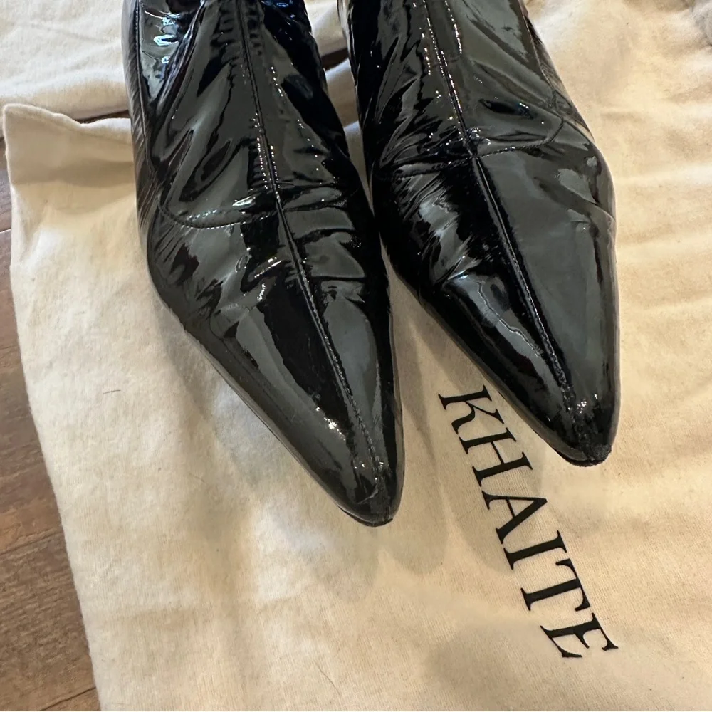 Khaite patent leather knee high boots